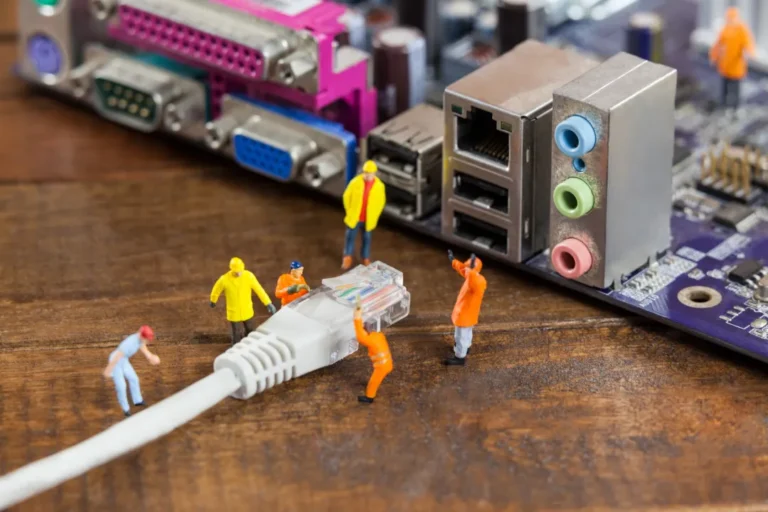 miniature-engineer-worker-plug-lan-cable-computer